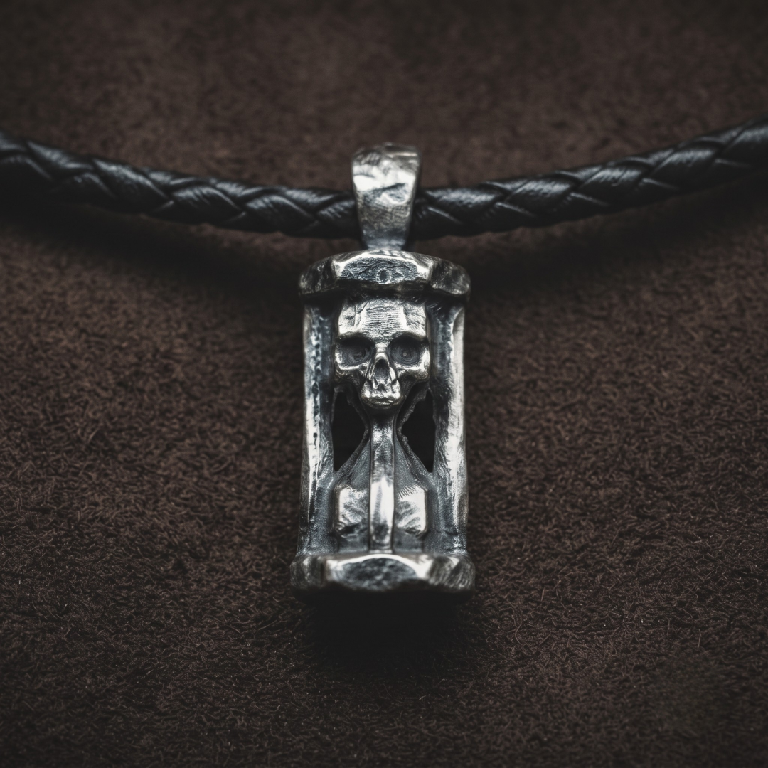 Eight Bells — hand-poured skull hourglass pendant in oxidized .999 fine silver on a black braided leather cord