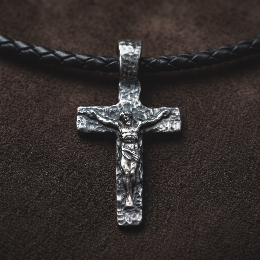 The Sixth Hour — hand-poured crucifix pendant in oxidized .999 fine silver on a black braided leather cord